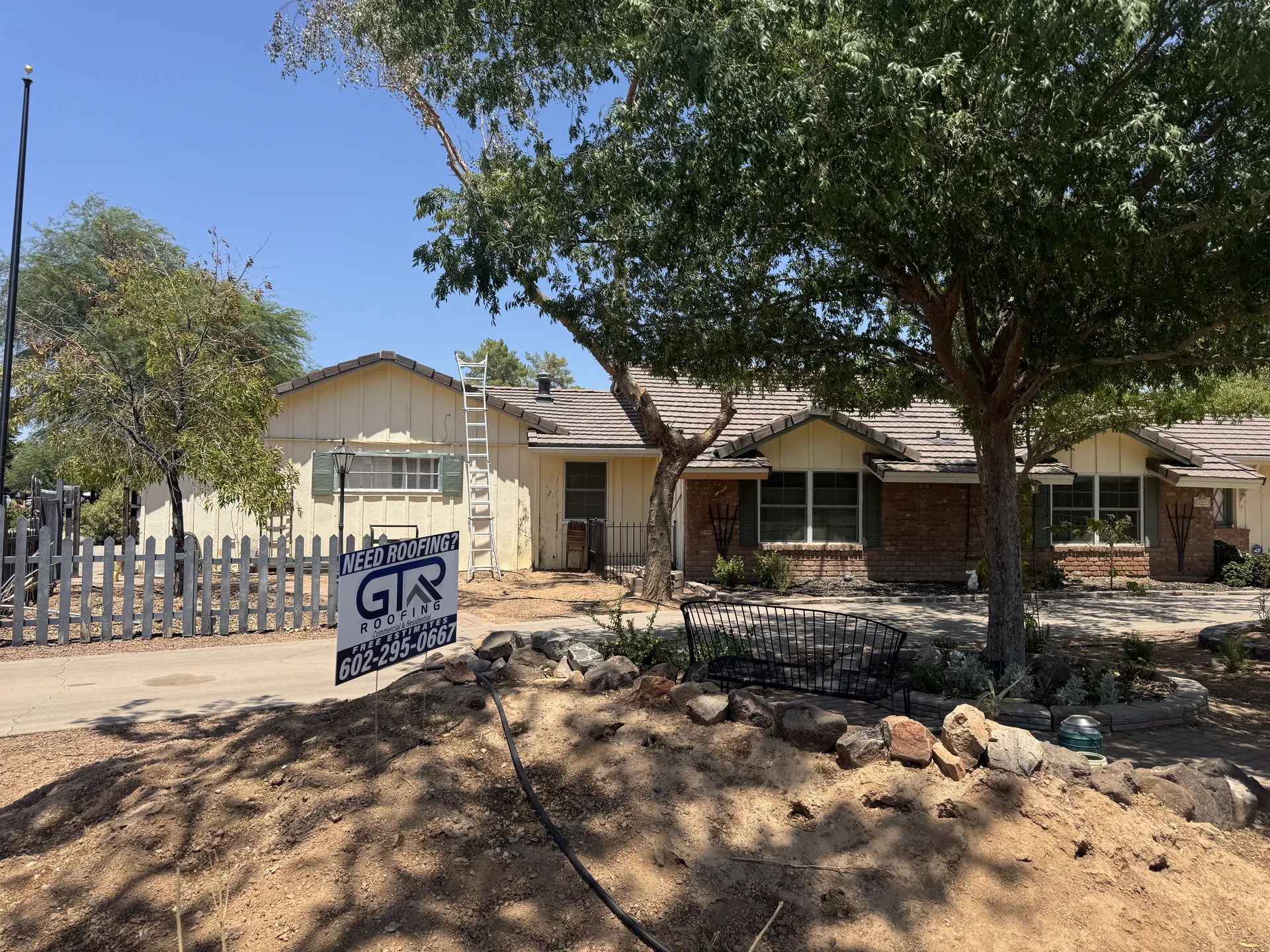 GTR Roofing crew completing residential roof tear-off in Phoenix Arizona